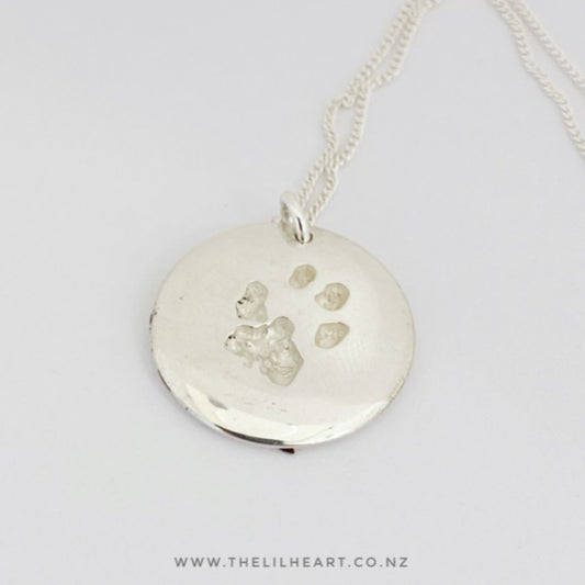 round paw print necklace dog and cat paw prints made in New Zealand in Sterling Silver